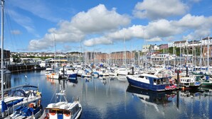 A marina with various boats docked, surrounded by buildings and a clear sky. - Rhyd y Groes, Holiday Cottage Burton, Sleeps 10, 5 bedrooms,  bathrooms (Milford Haven)