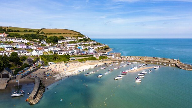 A coastal town with a marina, sandy beach, and residential buildings. - Robin Hill, Holiday Cottage Tresaith, Sleeps 5, 3 bedrooms,  bathrooms (Cardigan)