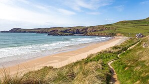 Enjoy a serene coastal escape with access to a sandy beach.