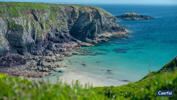 A coastal landscape with cliffs, clear turquoise waters, and a sandy beach. - Ty Siani, Holiday Cottage Trelerw, Nr St Davids, Sleeps 6, 3 bedrooms,  bathrooms (Haverfordwest)