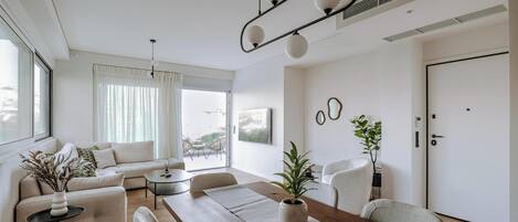 Exclusive Apartment | Living area | 55-inch Smart TV with cable channels, Netflix, streaming services