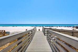 A wooden boardwalk leading to a beach with clear skies. - Condo w/ 1Br/1Ba, Public beach access + Free Tickets: WonderWorks & More! (Panama City Beach)