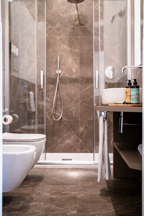 Hair dryer, bidet, towels, soap