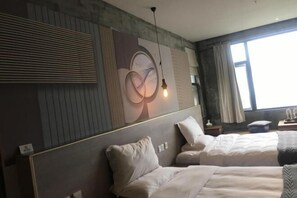 A hotel room with two beds, a large window with curtains, a wall-mounted artwork, and a hanging light fixture. - Youjian Shibashe Inn (Suzhou)