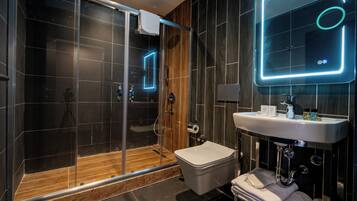 Shower, hair dryer, slippers, towels