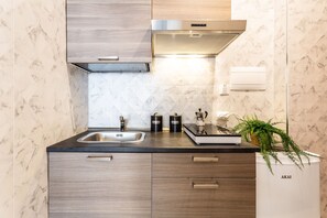 Fridge, cookware/dishes/utensils, dining tables