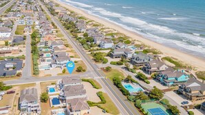 A coastal residential area with houses, a beach, and a road. - Aqua Palooza 🌊 Semi-Oceanfront 🏖️Pool & Hot Tub 💦 Elevator ⬆️ Pet Friendly🐕 (Nags Head)
