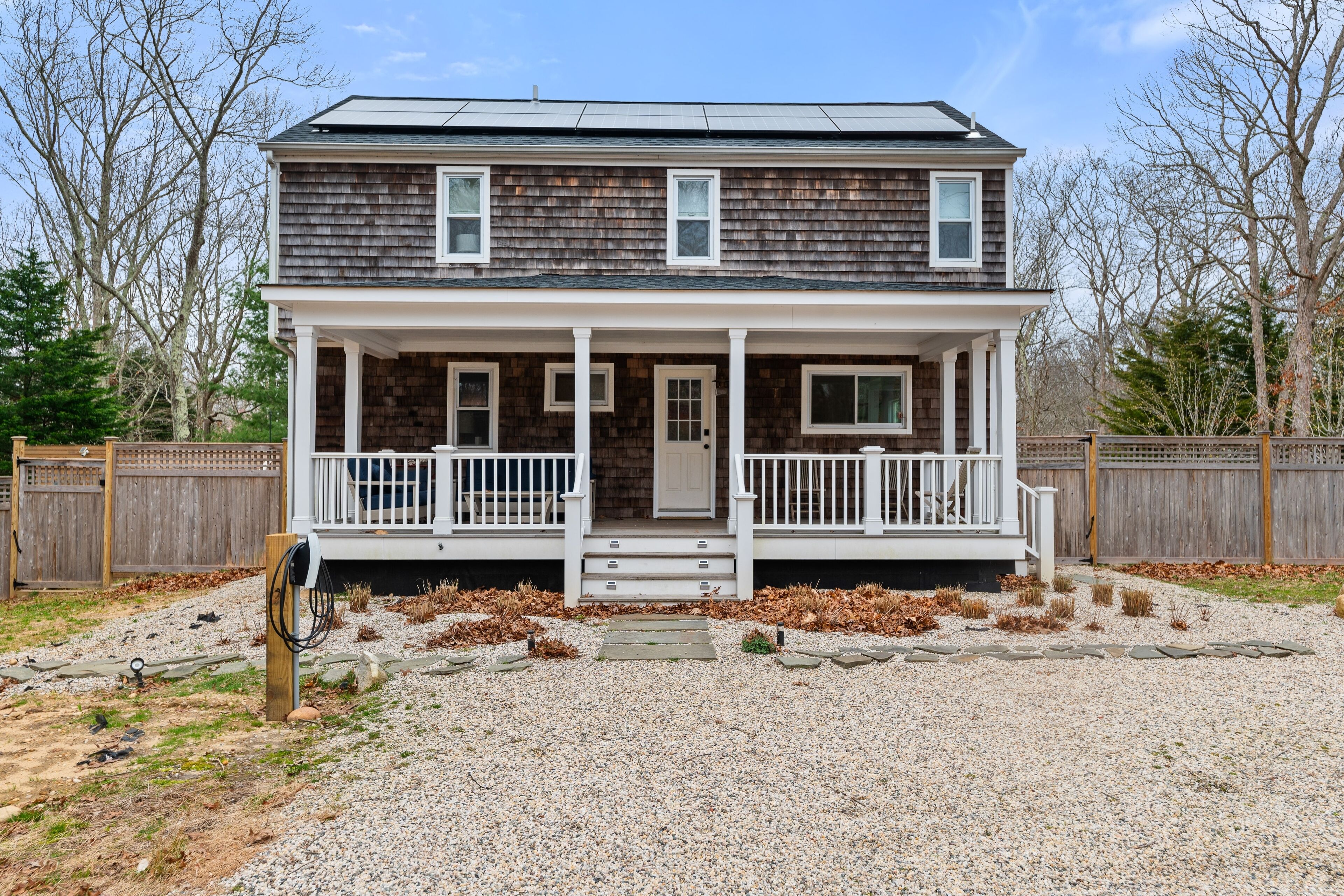 Two-story house with private pool, firepit, covered porch, yard, & bunk room