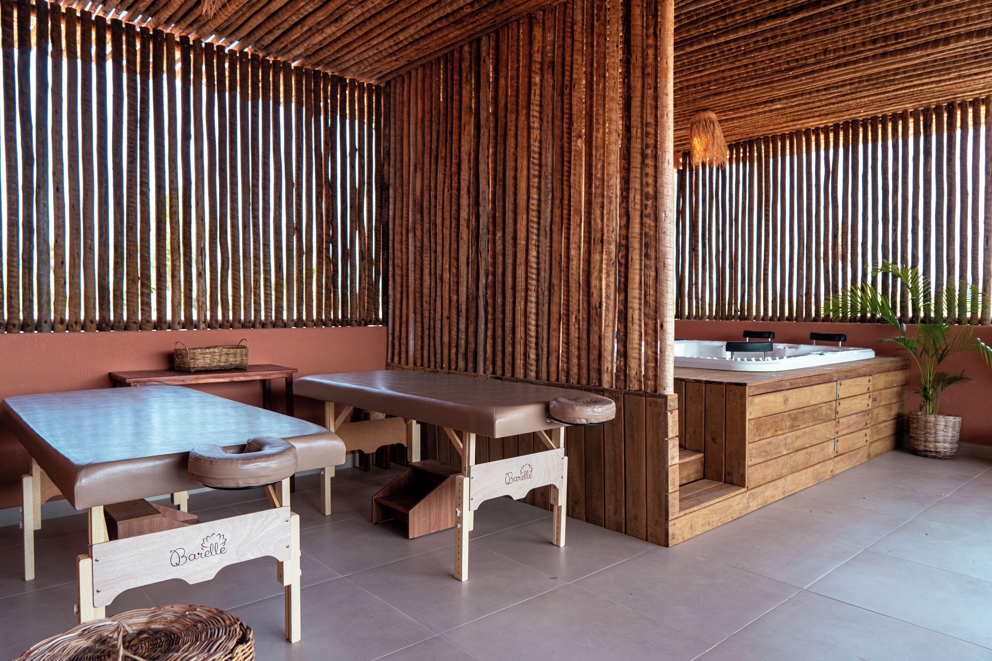 A wooden bar area with a bench and a counter.