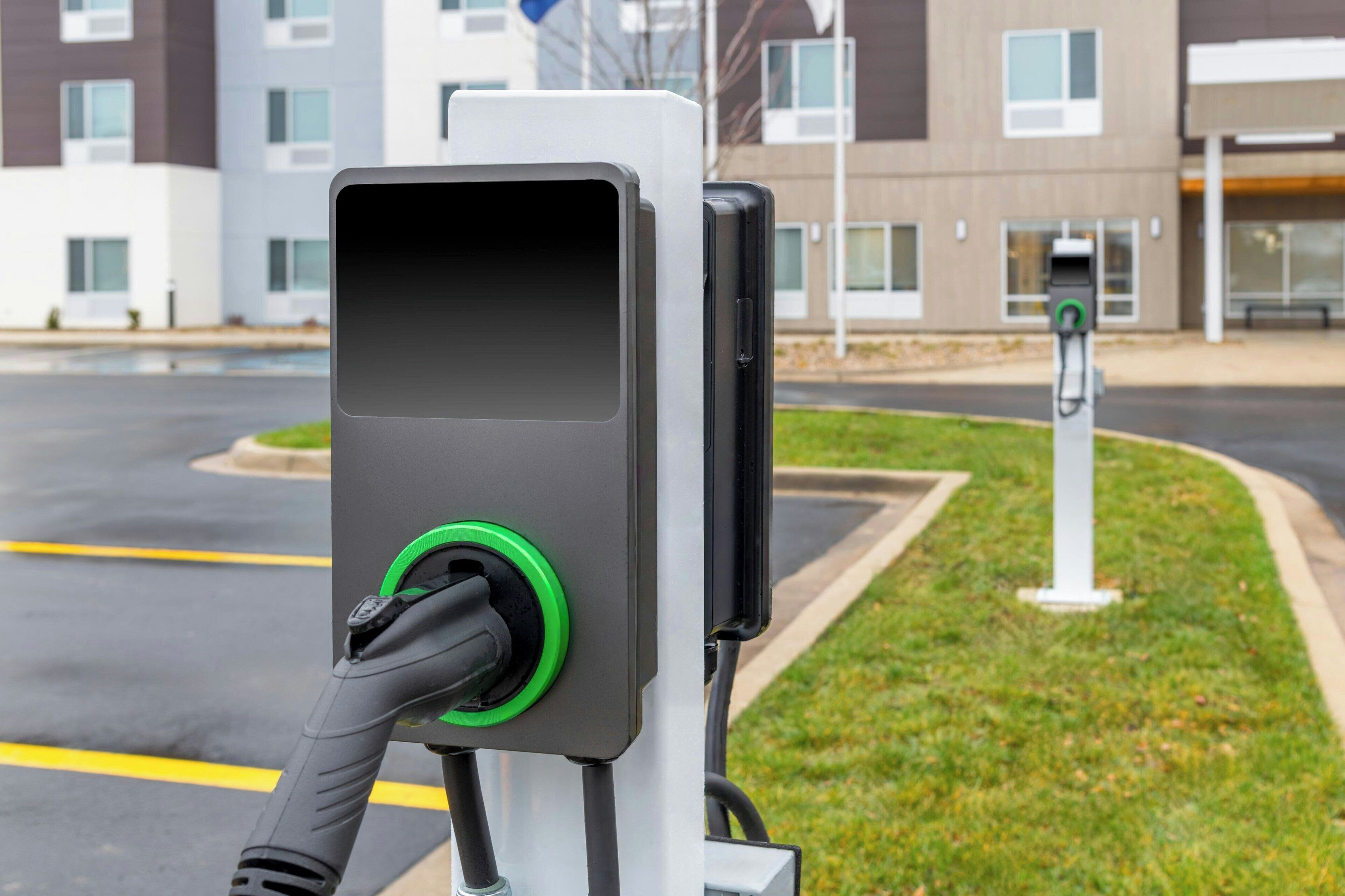 A parking station with a charging station for electric vehicles.