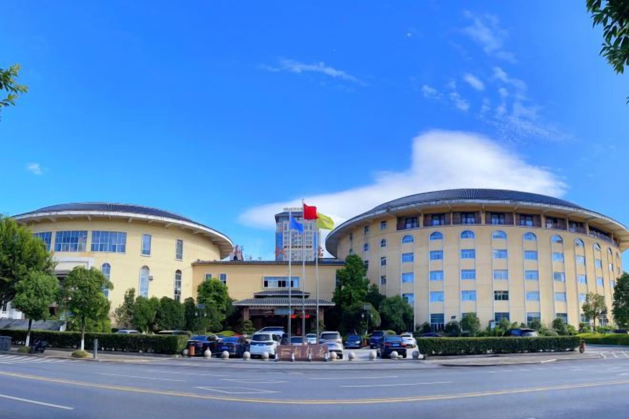 A large, circular building with a central entrance and multiple windows.
