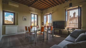 Deluxe Apartment, 2 Bedrooms | Living room | Flat-screen TV