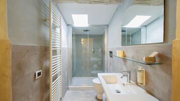 Deluxe Apartment, 2 Bedrooms | Bathroom | Shower, rainfall showerhead, hair dryer, slippers