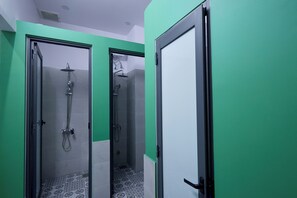 Standard Shared Dormitory, City View | Bathroom | Shower, rainfall showerhead, slippers, towels