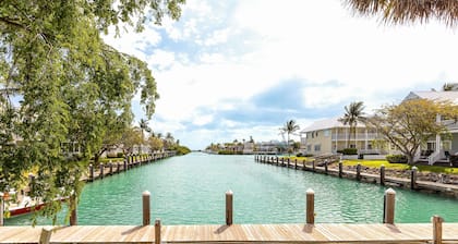 Waterfront, dog-friendly home with beautiful canal view & 2 shaded porches