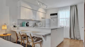 Premium Studio, Balcony, Beach View | Living area | 45-inch Smart TV with cable channels