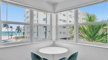 Exclusive Apartment, Balcony, Beach View | Living area | 45-inch Smart TV with cable channels