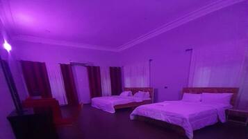 Family Double Room | Living area | 35-inch LED TV with cable channels