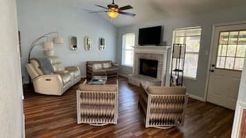 Smart TV, fireplace, books, offices