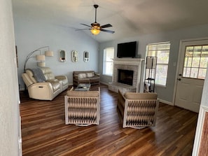 Smart TV, fireplace, books, offices