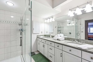 Shower, hair dryer, towels, shampoo