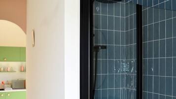 Shower, hair dryer, towels, soap