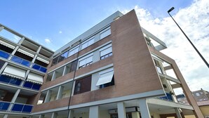 A multi-story building with balconies, large windows, and a clear sky. - SE076 - Senigallia, three-room apartment convenient to services (Senigallia)