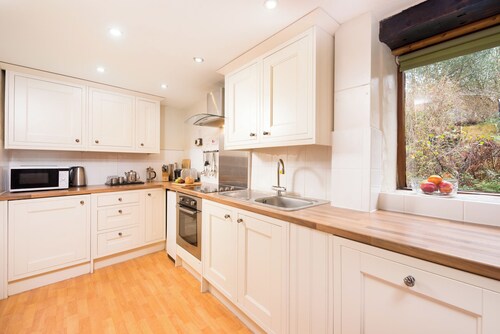 Traditional Byre Barn conversion with balcony off bedroom view North Devon Farm