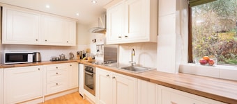 Traditional Byre Barn conversion with balcony off bedroom view North Devon Farm
