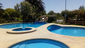 3 outdoor pools, open 11:00 AM to 8:00 PM, pool umbrellas