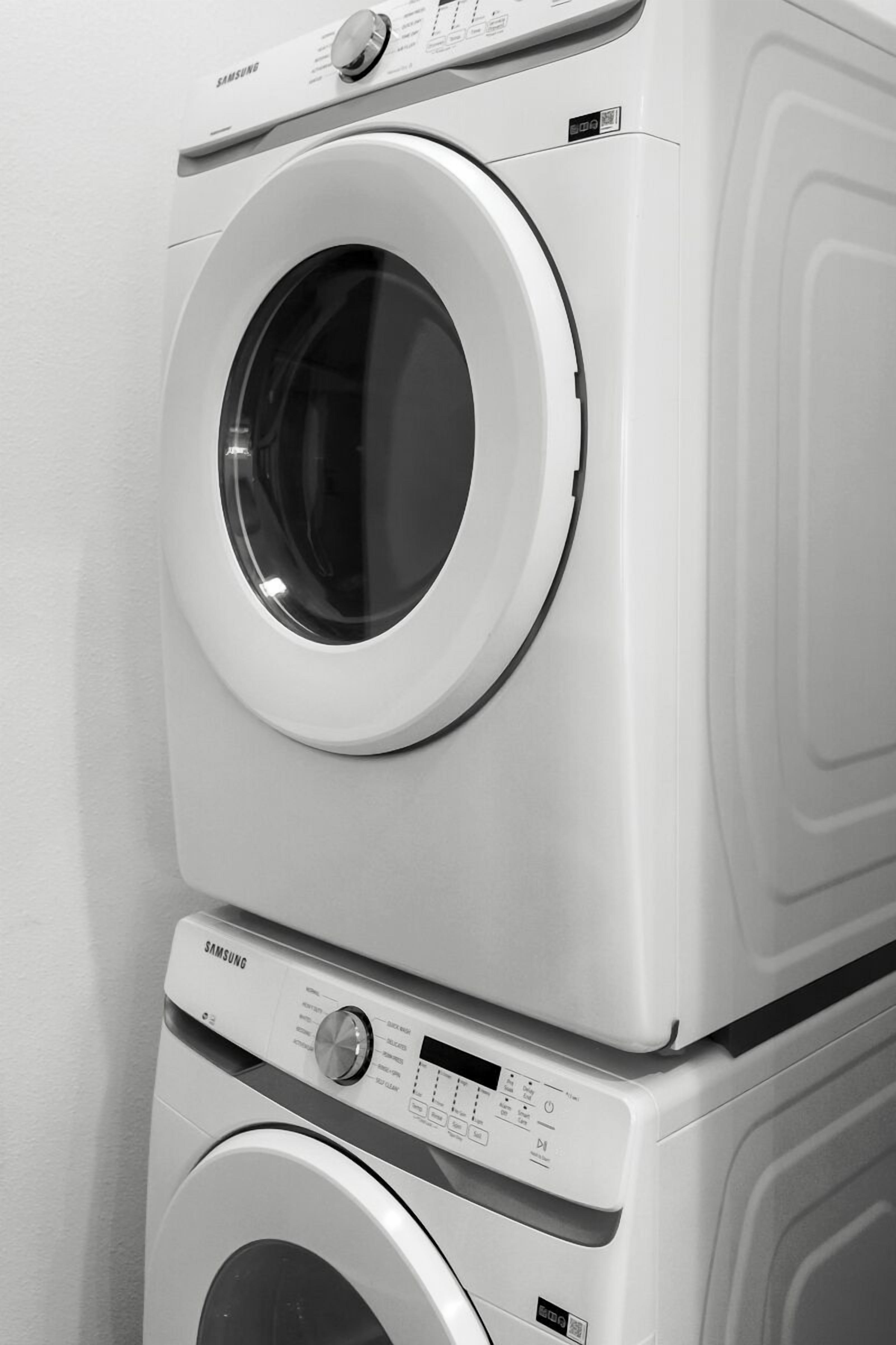 A stacked washer and dryer unit with a Samsung brand label.