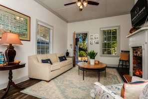 TV, fireplace - Creole Cottage | 2/1 | Pet Friendly w/ Fee, Walk to Downtown, Grill, Washer/Dryer (Natchez)