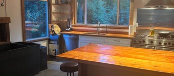 "Sleeps 15: Dog-Friendly Rustic Haven on Cortes Island" Large grass yard