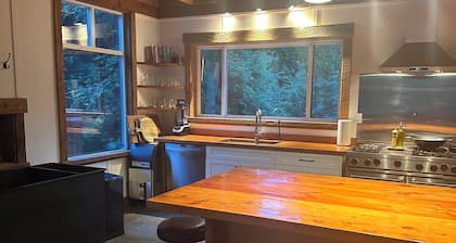 "Sleeps 15: Dog-Friendly Rustic Haven on Cortes Island" Large grass yard