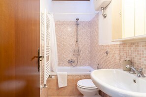 Hair dryer, bidet, towels, toilet paper