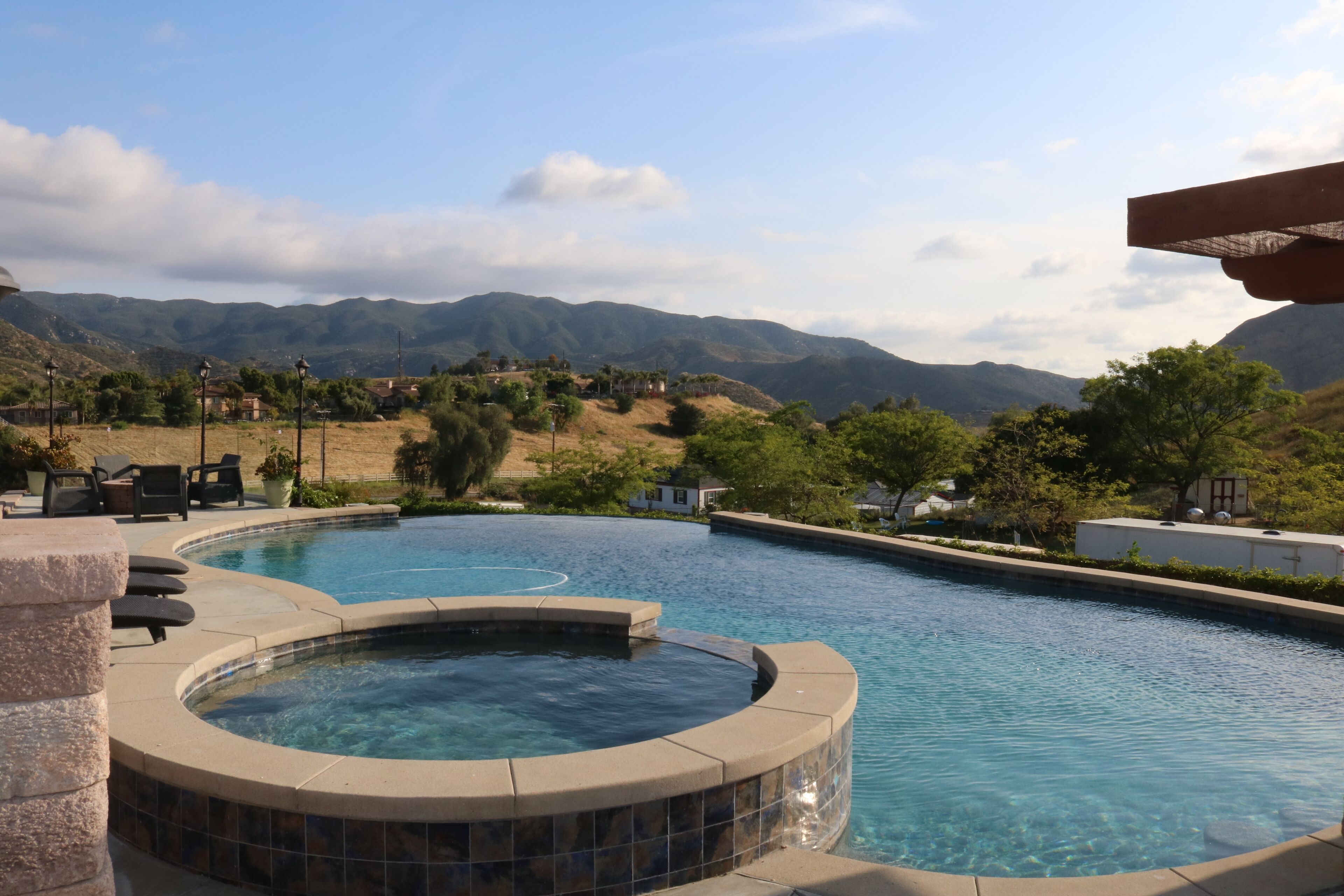 Home with infinity pool, hot tub, and mountain views. Pet-Friendly!