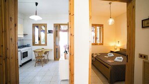 A room with a bed, bedside table, and a window. - Villetta Tesea In Residence Near The Sea, Melendugno, Italy (Melendugno)