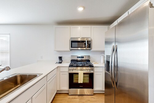 Dog-friendly home with a large, fenced yard, washer/dryer, & central AC