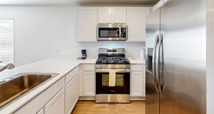 Dog-friendly home with a large, fenced yard, washer/dryer, & central AC