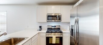 Dog-friendly home with a large, fenced yard, washer/dryer, & central AC