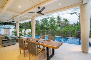 Family Villa, Patio, Pool View | Living area | 34-inch LCD TV with digital channels, Netflix, streaming services - AR Villa Sayan (Ubud)