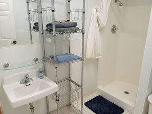 Shower, towels, soap, toilet paper