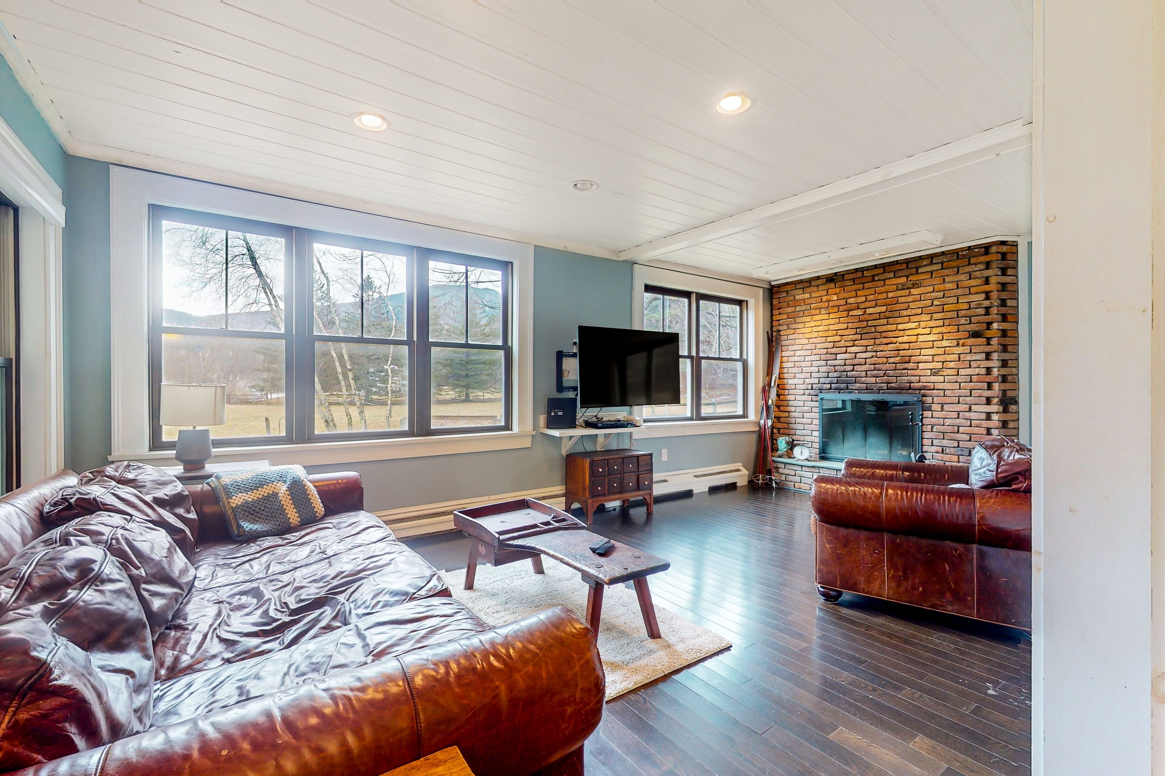 Sunny, dog-friendly home with a wood fireplace, fenced yard, washer/dryer