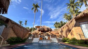 Outdoor pool, pool loungers, lifeguards on site