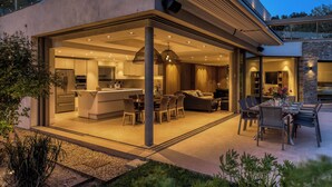 A modern house with an open-plan living area, kitchen, and dining space.