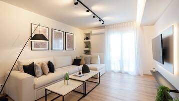 Deluxe Apartment, City View | Living area | 49-inch Smart TV with cable channels, Netflix, streaming services