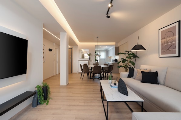 Deluxe Apartment, City View | Living area | 50-inch Smart TV with cable channels, Netflix, streaming services