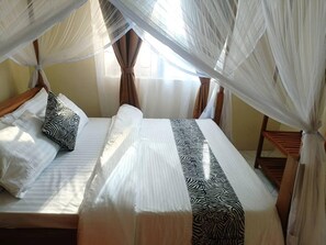 5 bedrooms, iron/ironing board, WiFi, bed sheets - 5 Bedroom private home out of town 
Quite environment suitable for everyone   (Arusha)