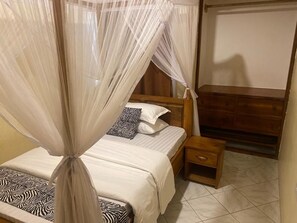 5 bedrooms, iron/ironing board, WiFi, bed sheets - 5 Bedroom private home out of town 
Quite environment suitable for everyone   (Arusha)