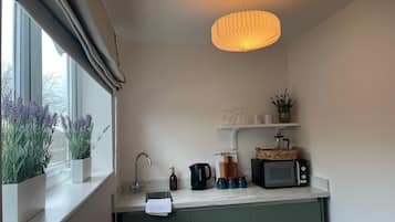 Deluxe Room | Private kitchen | Coffee/tea maker, highchair, eco-friendly cleaning products